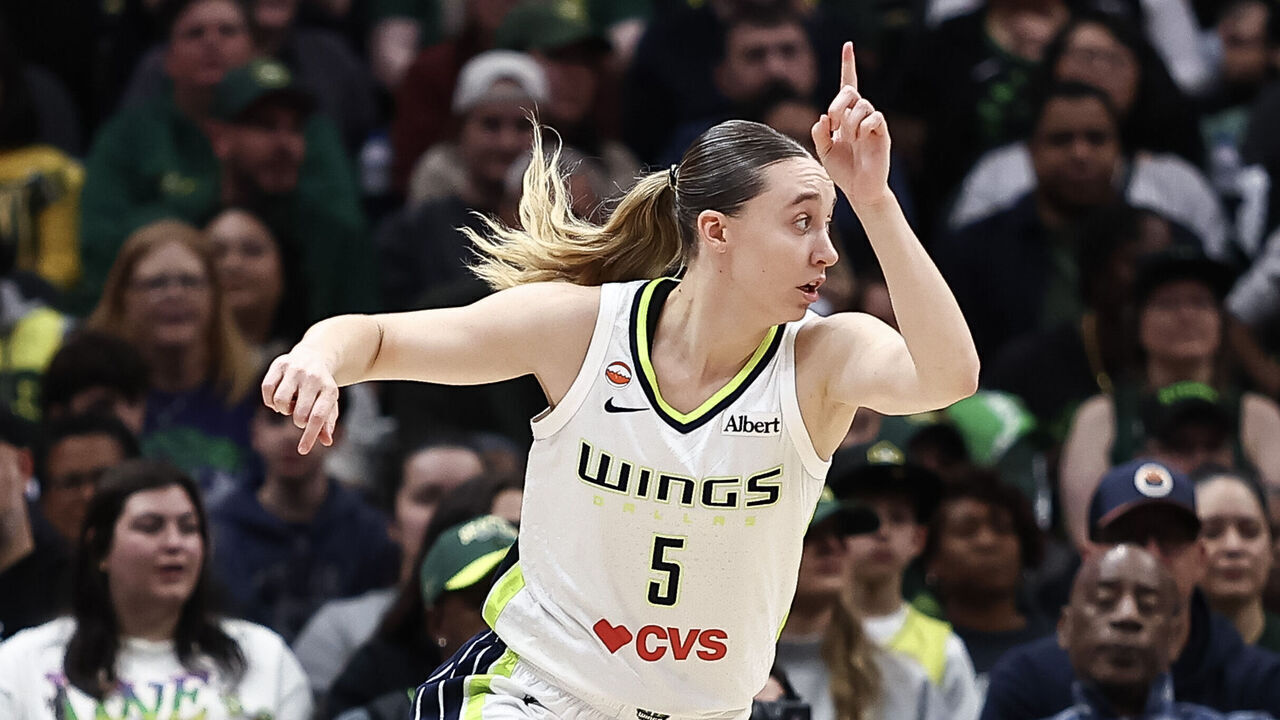 SEATTLE, WASHINGTON - SEPTEMBER 23: Paige Bueckers #5 of the Dallas Wings reacts after scoring against the Seattle Storm during the first half at Climate Pledge Arena on September 23, 2026 in Seattle, Washington.