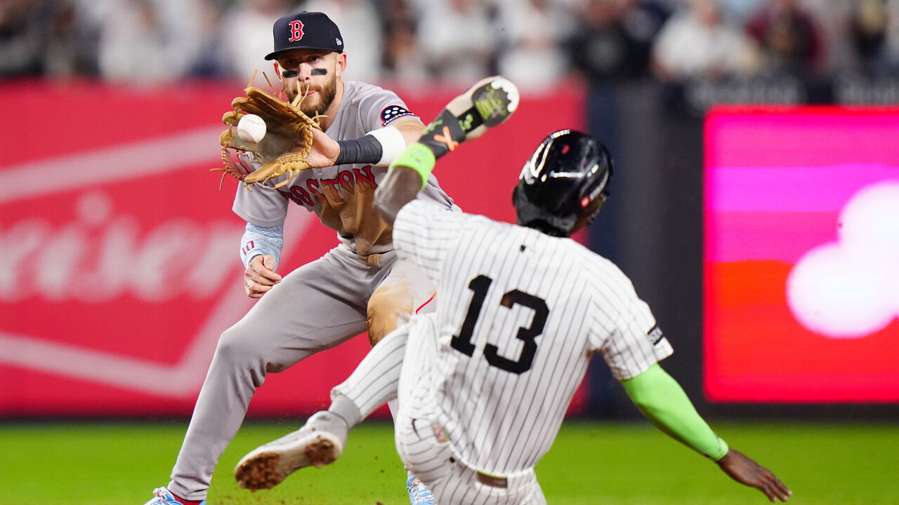 NEW YORK, NY - OCTOBER 02: Trevor Story #10 of the Boston Red Sox makes a catch to tag out Jazz Chisholm Jr. #13 of the New York Yankees in the sixth inning during Game Three of the American League Wild Card Series between the Boston Red Sox and the New York Yankees at Yankee Stadium on Thursday, October 2, 2025 in New York, New York.