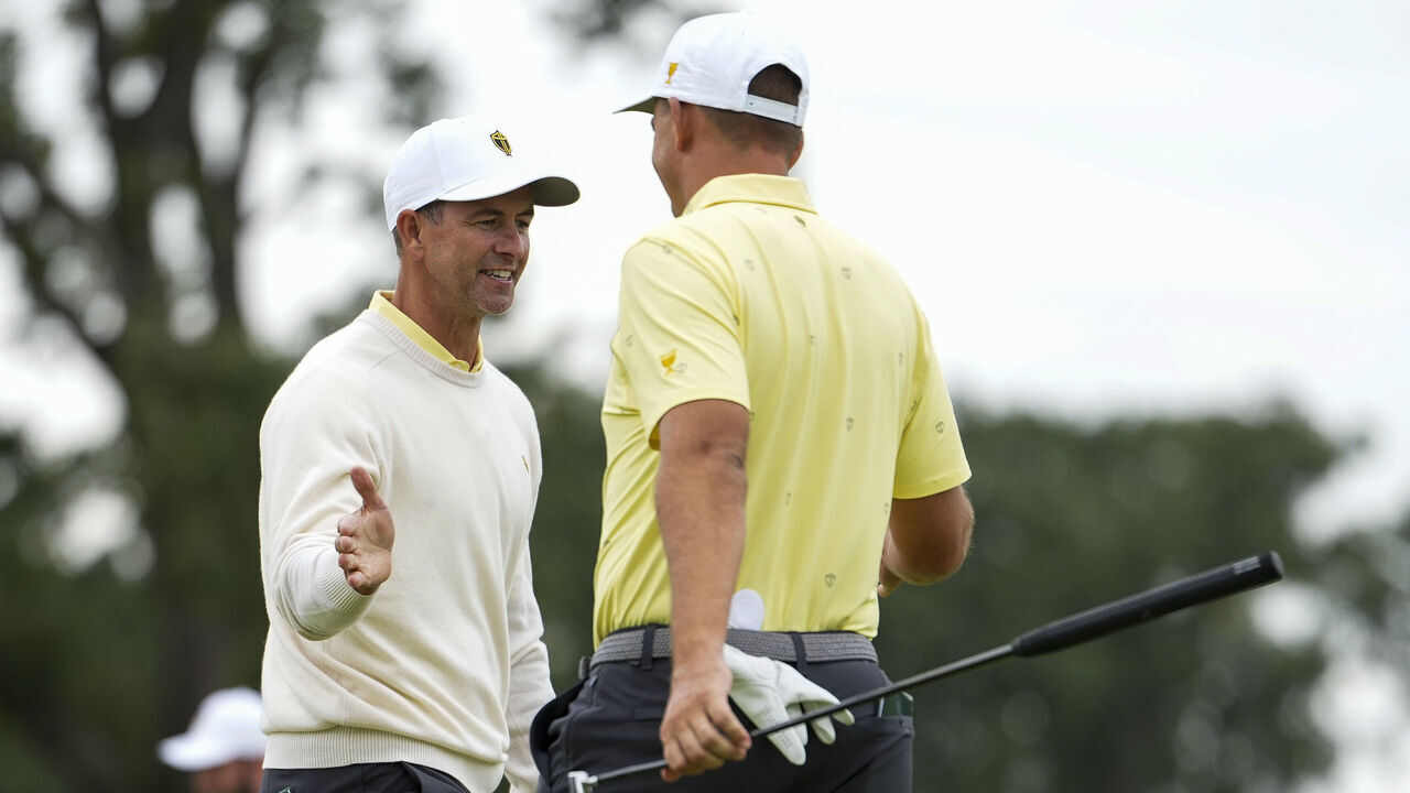 CHICAGO, ILLINOIS - SEPTEMBER 25: Adam Scott of the International Team and teammate Christian Bezuidenhout react to a putt on the seventh hole during Day Two of the Presidents Cup at Medinah Country Club Course No. 3 on September 25, 2026 in Chicago, Illinois.