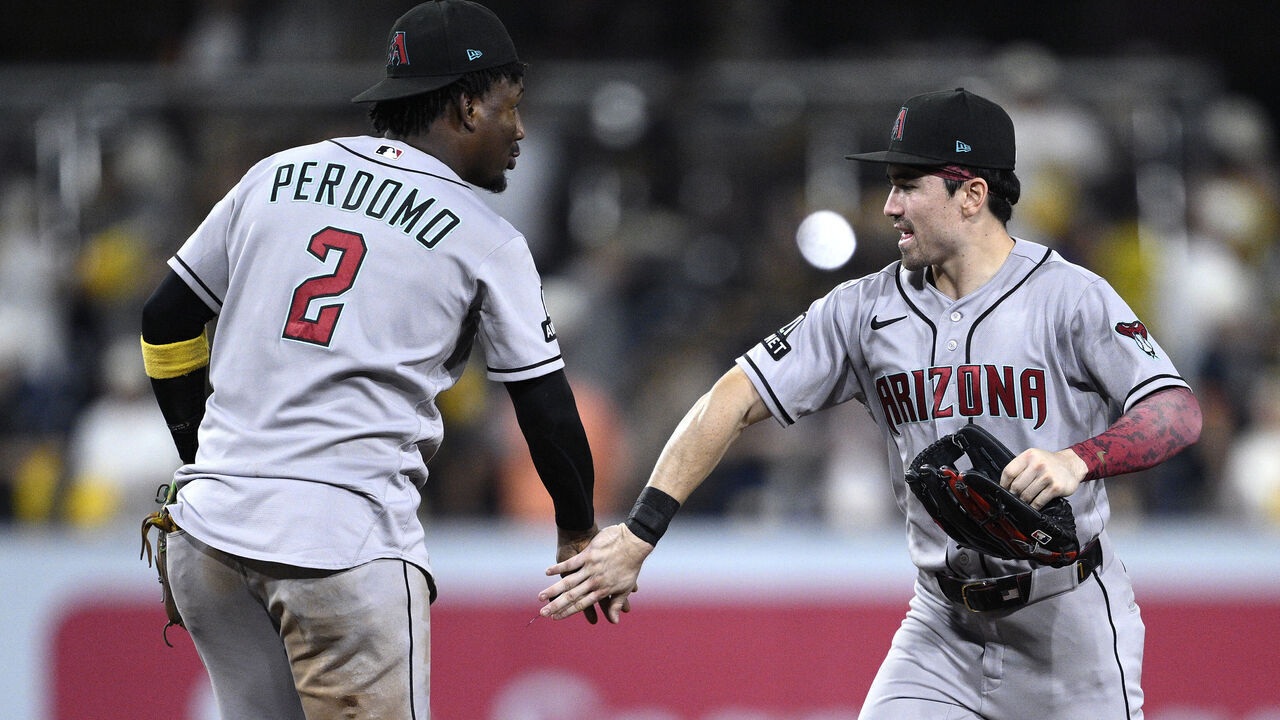 SAN DIEGO, CALIFORNIA - SEPTEMBER 25: Geraldo Perdomo #2 and Corbin Carroll #7 of the Arizona Diamondbacks celebrate on the field after defeating the San Diego Padres at Petco Park on September 25, 2026 in San Diego, California.