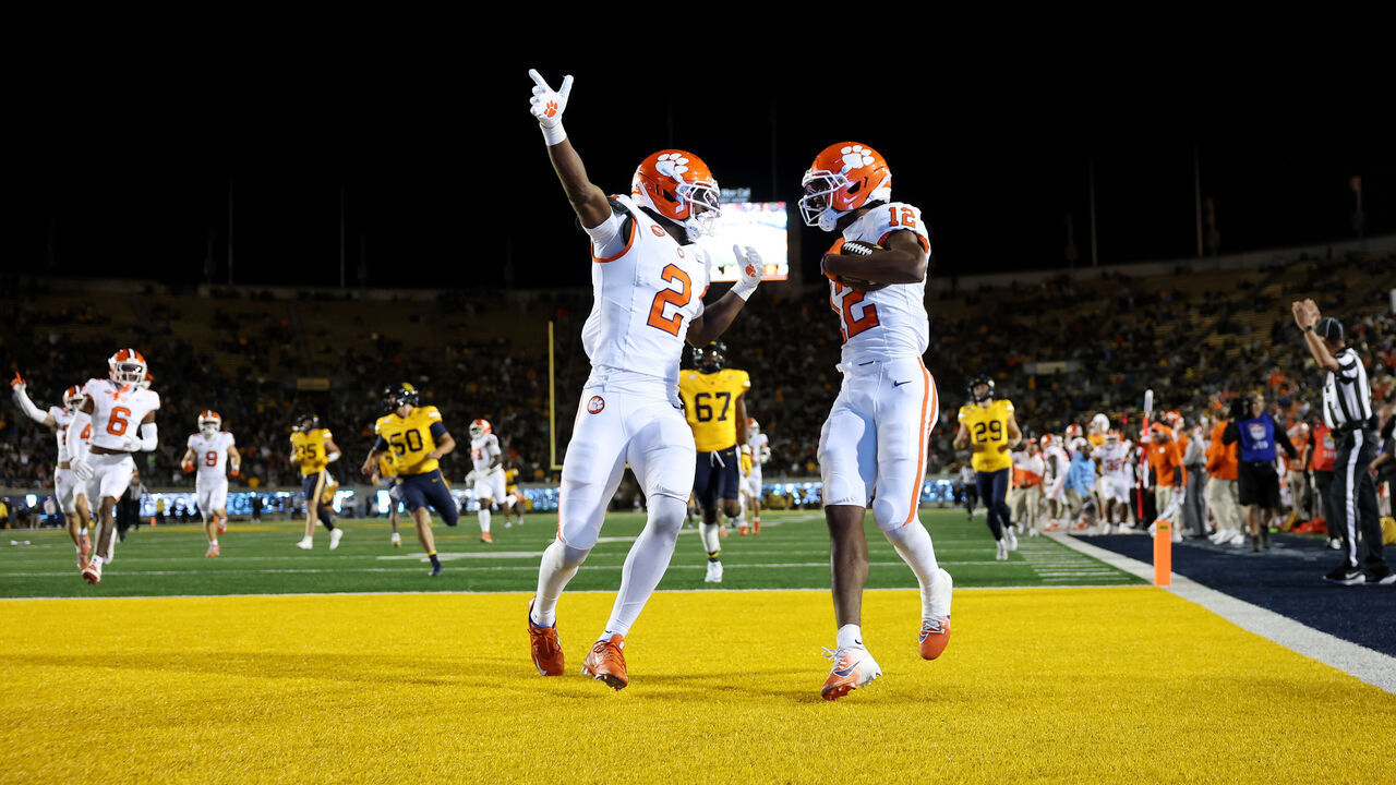 BERKELEY, CALIFORNIA - SEPTEMBER 25: Bryant Wesco Jr. #12 of the Clemson Tigers is congratulated by Ashton Hampton #2 as he returns a punt for a touchdown during the second half at California Memorial Stadium on September 25, 2026 in Berkeley, California.