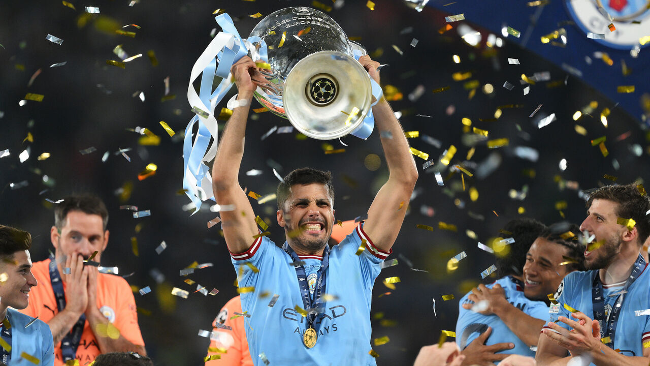 ISTANBUL, TURKEY - JUNE 10: Rodri of Manchester City celebrates with the UEFA Champions League trophy after the team's victory during the UEFA Champions League 2022/23 final match between FC Internazionale and Manchester City FC at Ataturk Olympic Stadium on June 10, 2023 in Istanbul, Turkey.