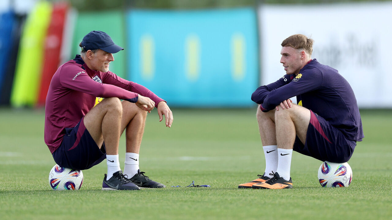 GIRONA, SPAIN - JUNE 02: Thomas Tuchel, Head Coach of England, talks to Cole Palmer of England during a training session at the England Men's Senior Team's training base on June 02, 2025 in Girona, Spain