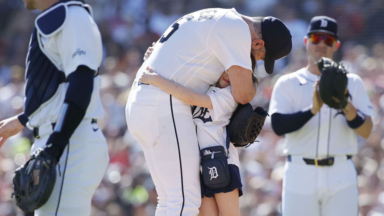 DETROIT, MI - SEPTEMBER 26: Justin Verlander #35 of the Detroit Tigers hugs his daughter Genevieve before leaving his final game against the Pittsburgh Pirates during the sixth inning at Comerica Park on September 26, 2026 in Detroit, Michigan.
