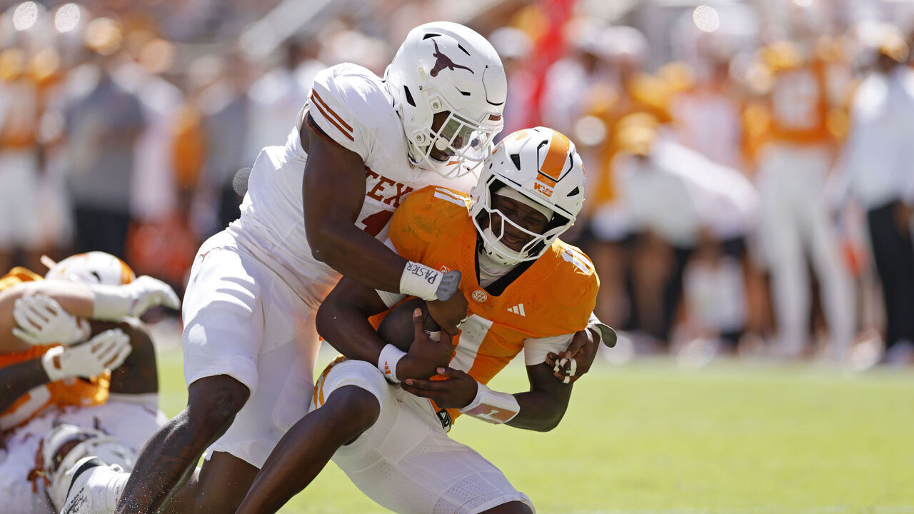 KNOXVILLE, TN - SEPTEMBER 26: Defensive end Colin Simmons (1) of the Texas Longhorns sacks quarterback Faizon Brandon (11) of the Tennessee Volunteers during the college football game on September 26, 2026 at Neyland Stadium in Knoxville, Tennessee.
