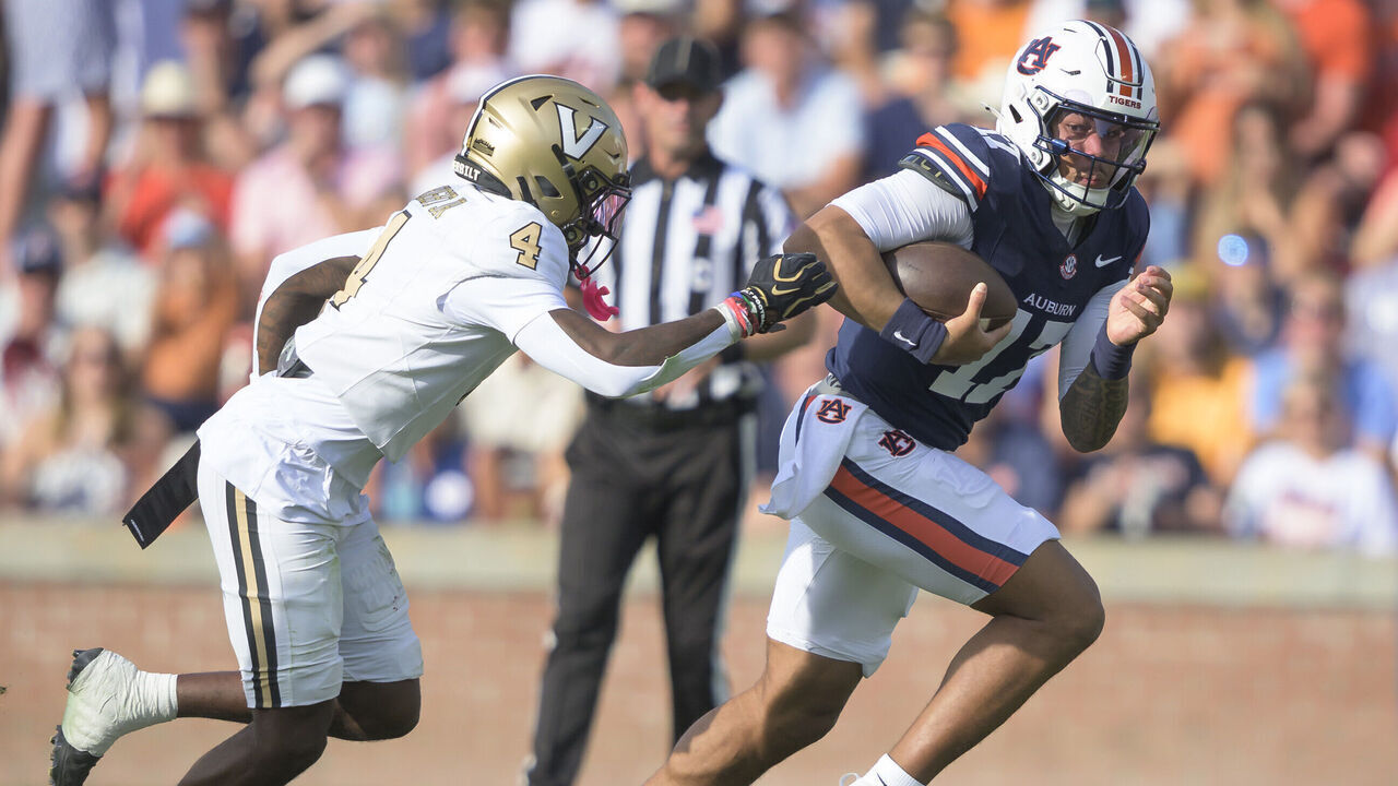 AUBURN, ALABAMA - SEPTEMBER 26: Quarterback Byrum Brown #17 of the Auburn Tigers looks to run the ball by cornerback Martel Hight #4 of the Vanderbilt Commodores during the first half of play at Jordan-Hare Stadium on September 26, 2026 in Auburn, Alabama.