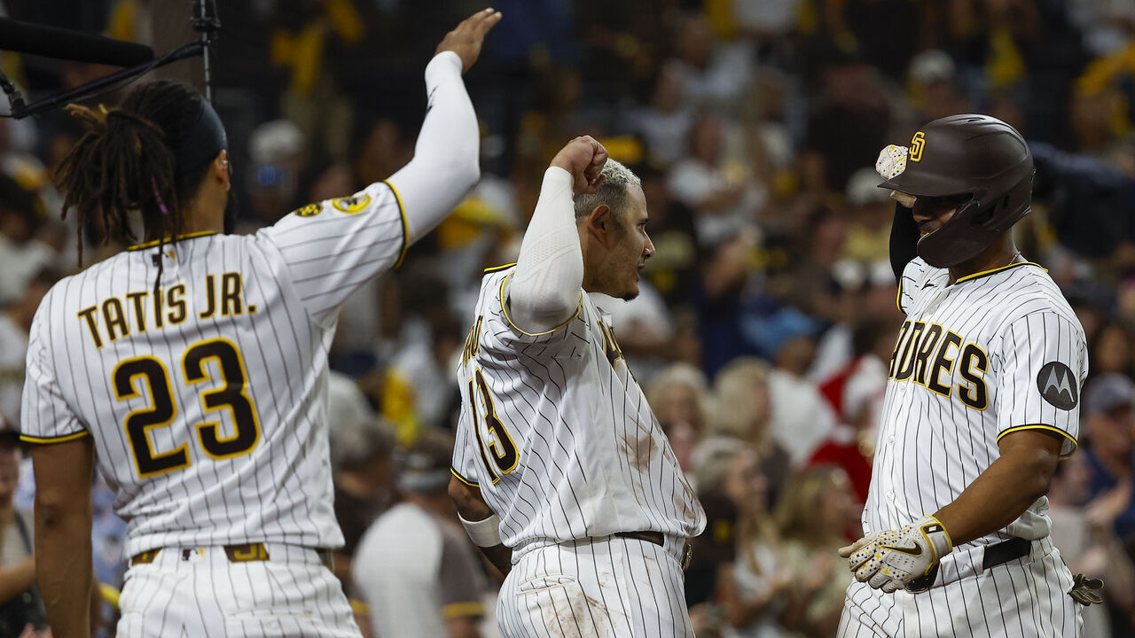 San Diego, California - September 26: Fernando Tatis Jr. #23, Manny Machado #13 and Xander Bogaerts #2 of the San Diego Padres celebrate after Bogaerts home run against the Arizona Diamondbacks during the fifth inning at Petco Park on Saturday, Sept. 26, 2026 in San Diego, California.