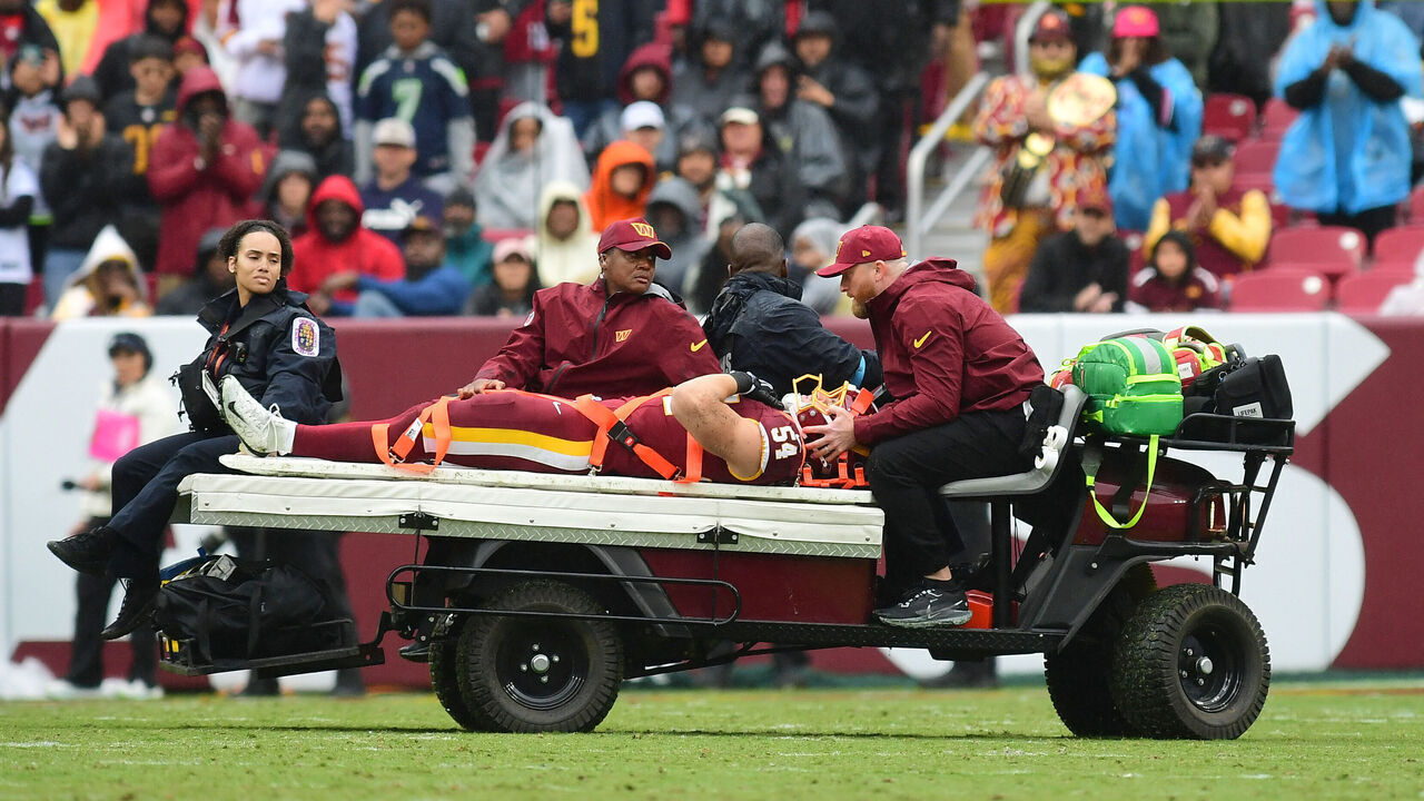 LANDOVER, MD - SEPTEMBER 27: Washington linebacker Leo Chenal (54) is carted off the field after a first half injury during the Seattle Seahawks versus Washington Commanders National Football League game at Northwest Stadium on September 27, 2026 in Landover, MD.