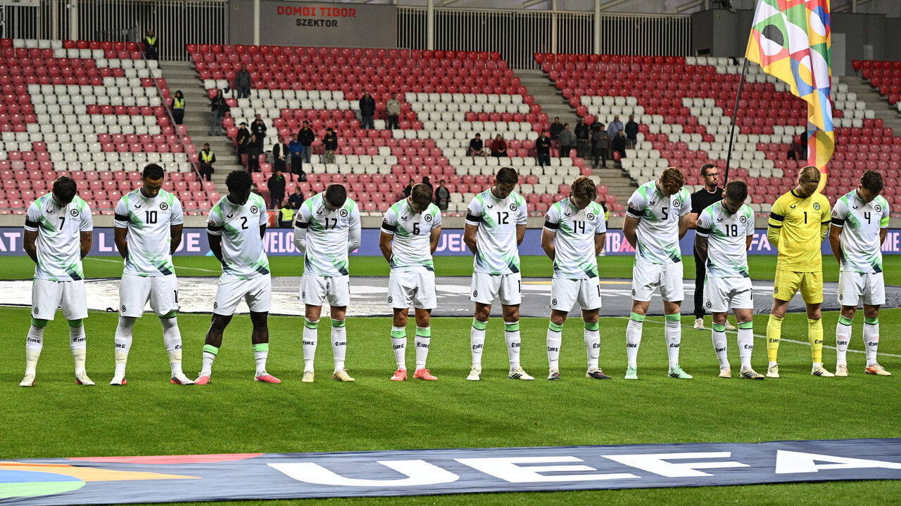 DEBRECEN, HUNGARY - SEPTEMBER 27: Ireland players with black armbands line up with heads down during the Israel national anthem prior to the UEFA Nations League 2026/27 group phase match between Israel and Republic of Ireland at Nagyerdei Stadion on September 27, 2026 in Debrecen, Hungary.