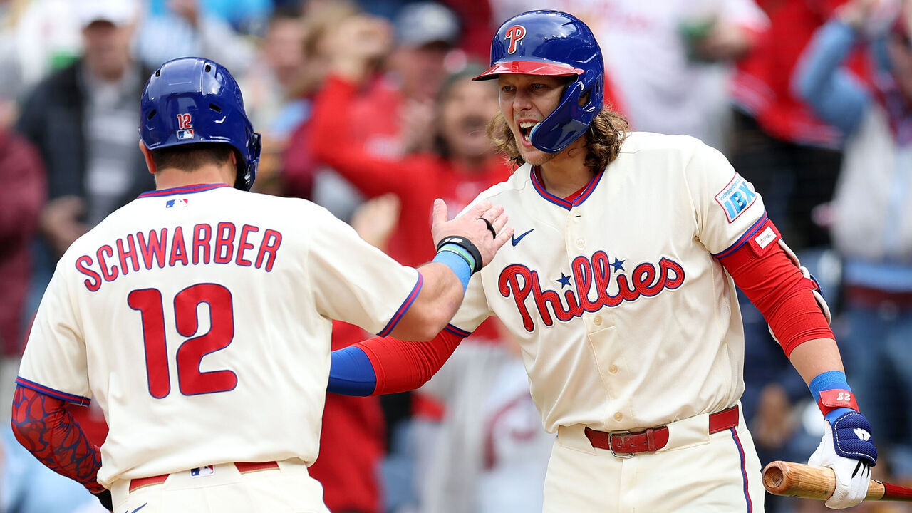 PHILADELPHIA, PENNSYLVANIA - SEPTEMBER 27: Kyle Schwarber #12 of the Philadelphia Phillies celebrates with Alec Bohm #28 after scoring on an RBI double by Bryson Stott #5 (not pictured) in the first inning during a game against the Tampa Bay Rays at Citizens Bank Park on September 27, 2026 in Philadelphia, Pennsylvania.