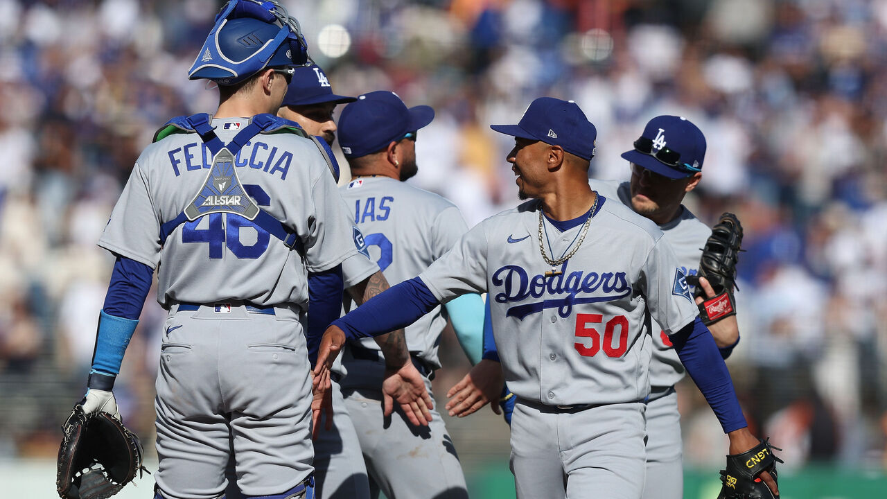 SAN FRANCISCO, CALIFORNIA - SEPTEMBER 26: Mookie Betts #50 and Hunter Feduccia #46 of the Los Angeles Dodgers celebrate after a win against the San Francisco Giants at Oracle Park on September 26, 2026 in San Francisco, California.