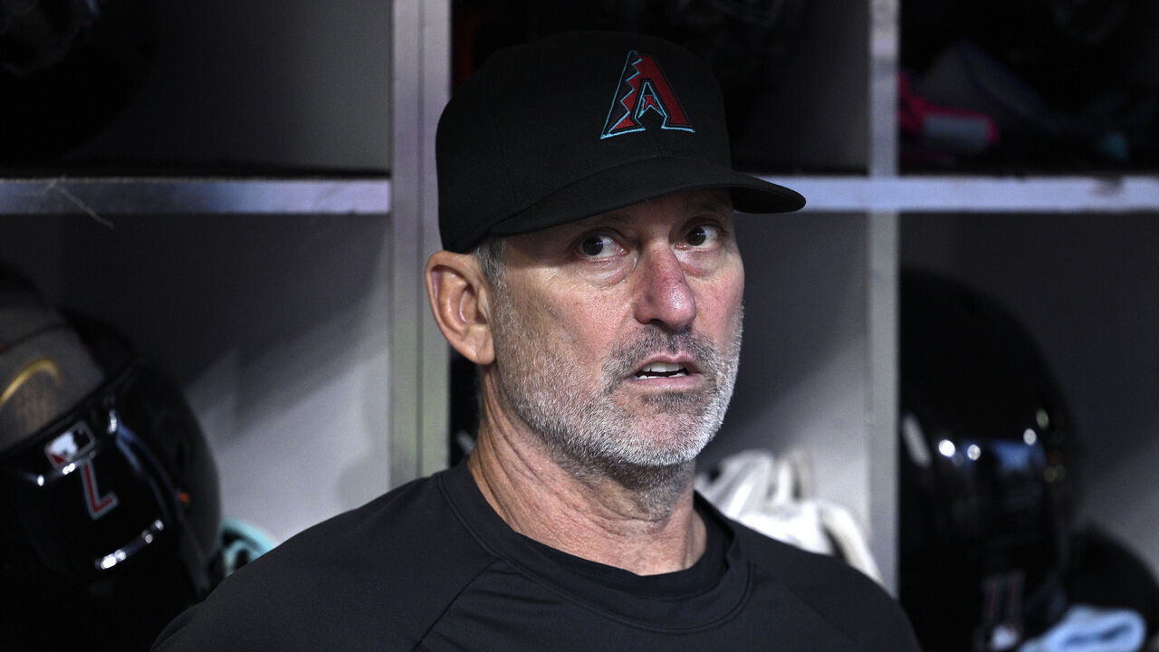 SAN DIEGO, CALIFORNIA - SEPTEMBER 25: Manager Torey Lovullo #17 of the Arizona Diamondbacks looks on from the dugout before the game against the San Diego Padres at Petco Park on September 25, 2026 in San Diego, California.