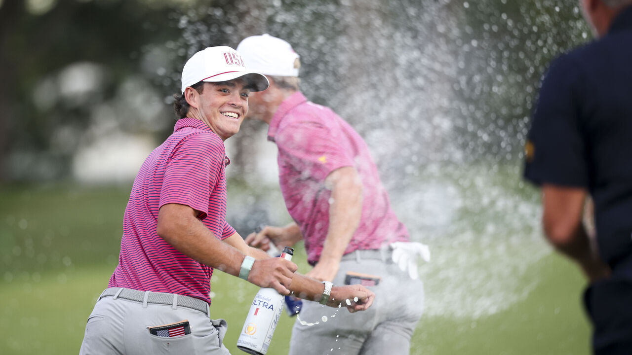 CHICAGO, ILLINOIS - SEPTEMBER 27: Jackson Koivun of the U.S. Team celebrates with teammates after the U.S. Team defeated the International Team, 17-13, to win the Presidents Cup at Medinah Country Club Course No. 3 on September 27, 2026 in Chicago, Illinois.