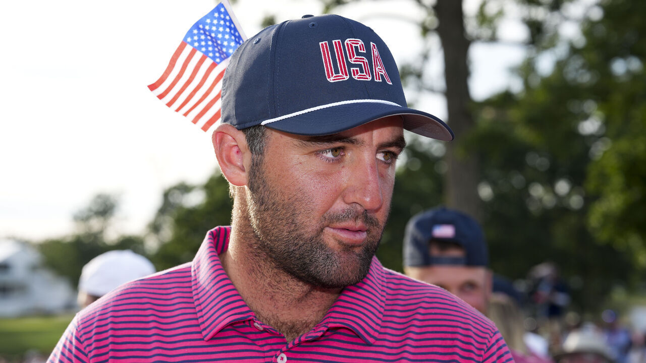 CHICAGO, ILLINOIS - SEPTEMBER 27: Scottie Scheffler of the U.S. Team looks on after the U.S. Team defeated the International Team, 17-13, to win the Presidents Cup at Medinah Country Club Course No. 3 on September 27, 2026 in Chicago, Illinois.