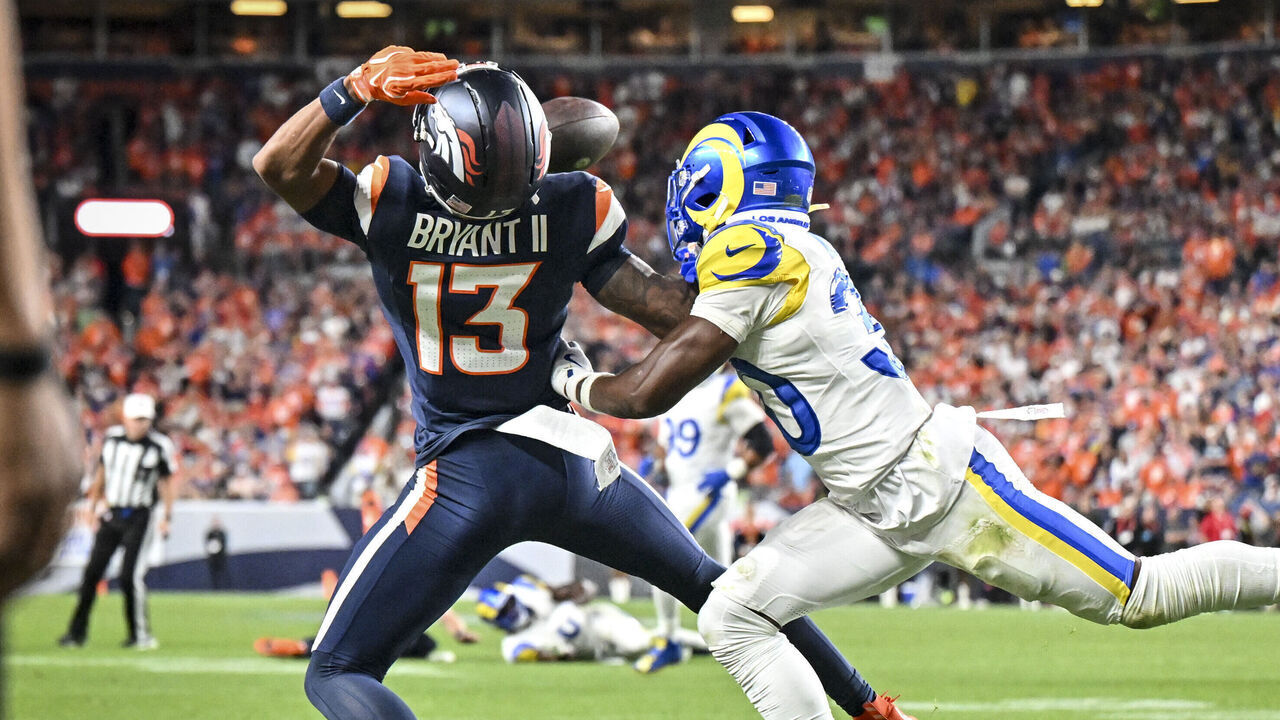 DENVER , CO - SEPTEMBER 27: Josh Wallace (30) of the Los Angeles Rams gets called for a pass interference penalty as he shoves Pat Bryant (13) of the Denver Broncos during the fourth quarter of the Broncos' 30-26 win at Empower Field at Mile High in Denver, Colorado on Sunday, September 27, 2026.