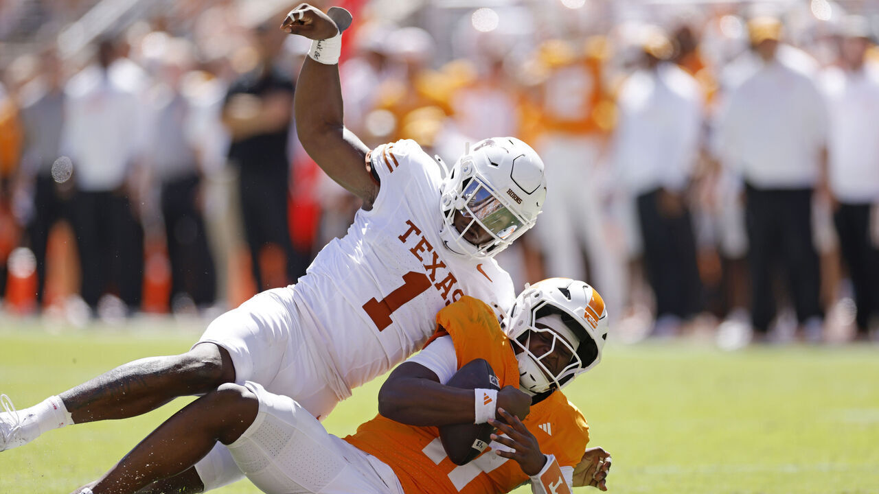 KNOXVILLE, TN - SEPTEMBER 26: Defensive end Colin Simmons (1) of the Texas Longhorns sacks quarterback Faizon Brandon (11) of the Tennessee Volunteers during the college football game on September 26, 2026 at Neyland Stadium in Knoxville, Tennessee.