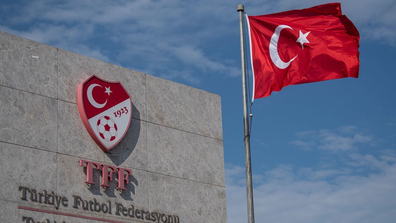 This picture taken on May 6, 2020 in Istanbul shows a logo of Turkish Football Federation (TFF) at the entrance of the organization's headquarters. - Turkey's Super Lig will resume on June 12, the football federation said on May 6, after games were suspended in March because of the Covid-19 pandemic caused by the novel coronavirus.