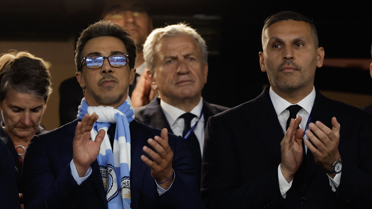 The Manchester City owner Abu Dhabi royal Sheikh Mansour bin Zayed Al Nahyan (centre with scarf) next to chairman Khaldoon Al Mubarrak (right) as the teams come onto the pitch before the UEFA Champions League Final between Manchester City and Inter Milan at the Ataturk Olympic Stadium on June 10th 2023 in Istanbul, Turkey