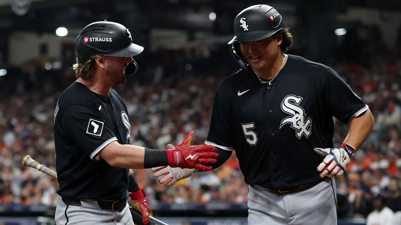 HOUSTON, TEXAS - SEPTEMBER 29: Chase Meidroth #10 and Munetaka Murakami #5 of the Chicago White Sox celebrate after Murakami scored a run in the seventh inning against the Houston Astros in game one of the American League Wild Card Series at Daikin Park on September 29, 2026 in Houston, Texas.