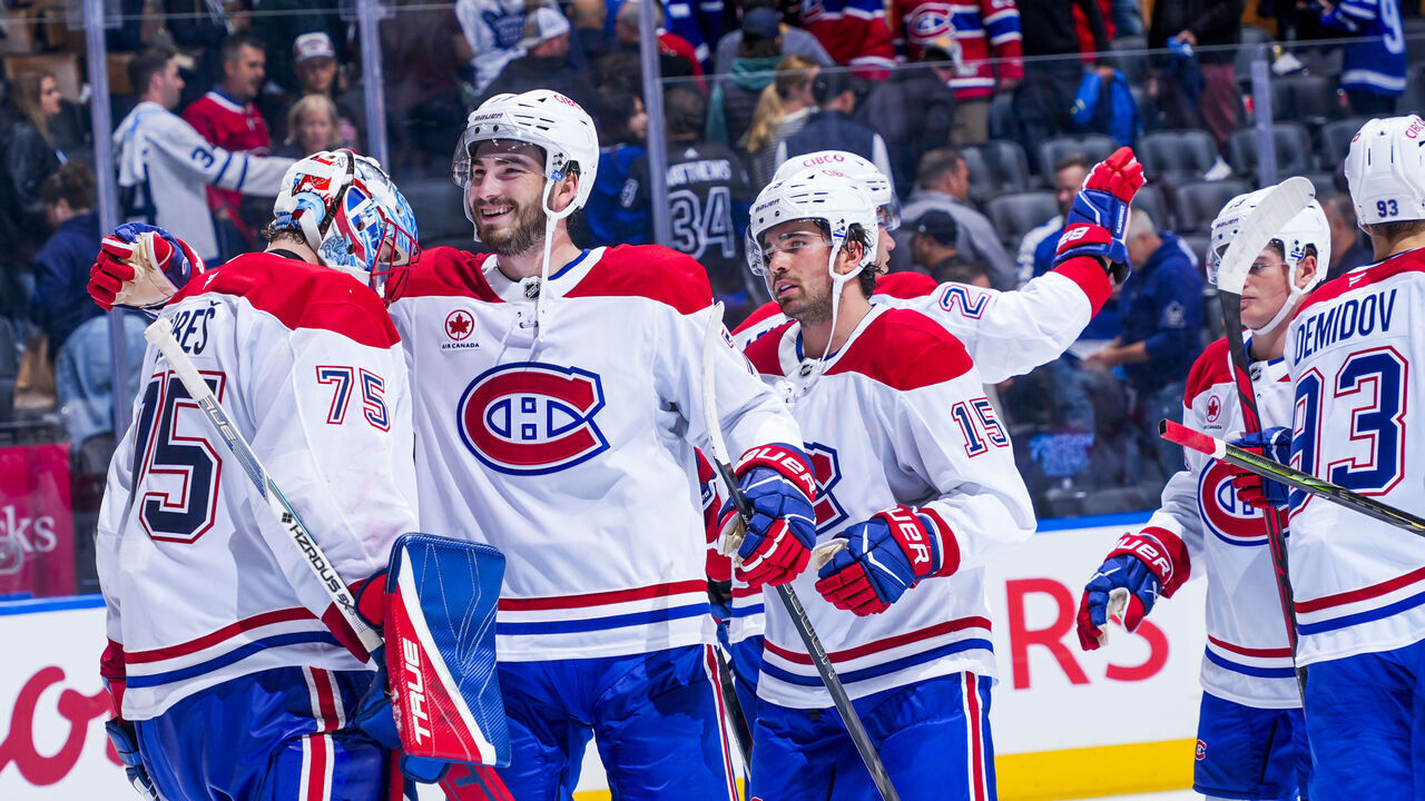 TORONTO, ON - SEPTEMBER 29: Jakub Dobes #75 and Jake Evans #71 of the Montreal Canadiens celebrate a win over the Toronto Maple Leafs at the Scotiabank Arena on September 29, 2026 in Toronto, Ontario, Canada.