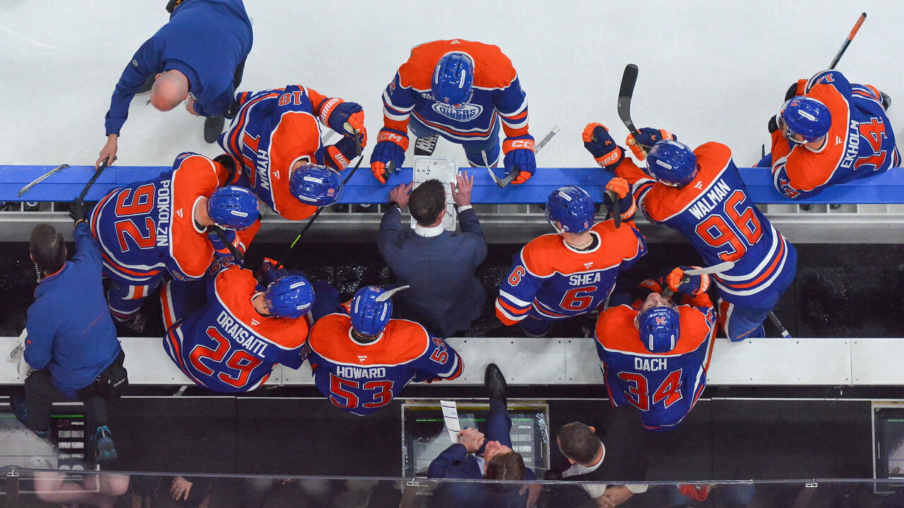 EDMONTON, CANADA - SEPTEMBER 29: Assistant Coach Paul McFarland of the Edmonton Oilers draws up a play during a time-out in the third period of the game against the Vancouver Canucks at Rogers Place on September 29, 2026, in Edmonton, Alberta, Canada.