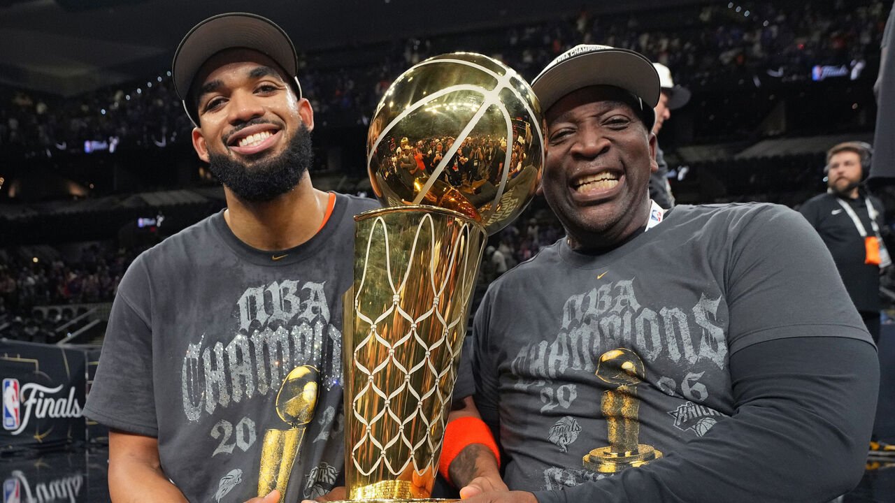SAN ANTONIO, TX - JUNE 13: Karl Anthony Towns Sr. and Karl-Anthony Towns #32 of the New York Knicks celebrates after winning the NBA Finals against the San Antonio Spurs during Game Five of the 2026 NBA Finals on June 13, 2026 at Frost Bank Center in San Antonio, Texas. Mandatory Copyright Notice: Copyright 2026 NBAE