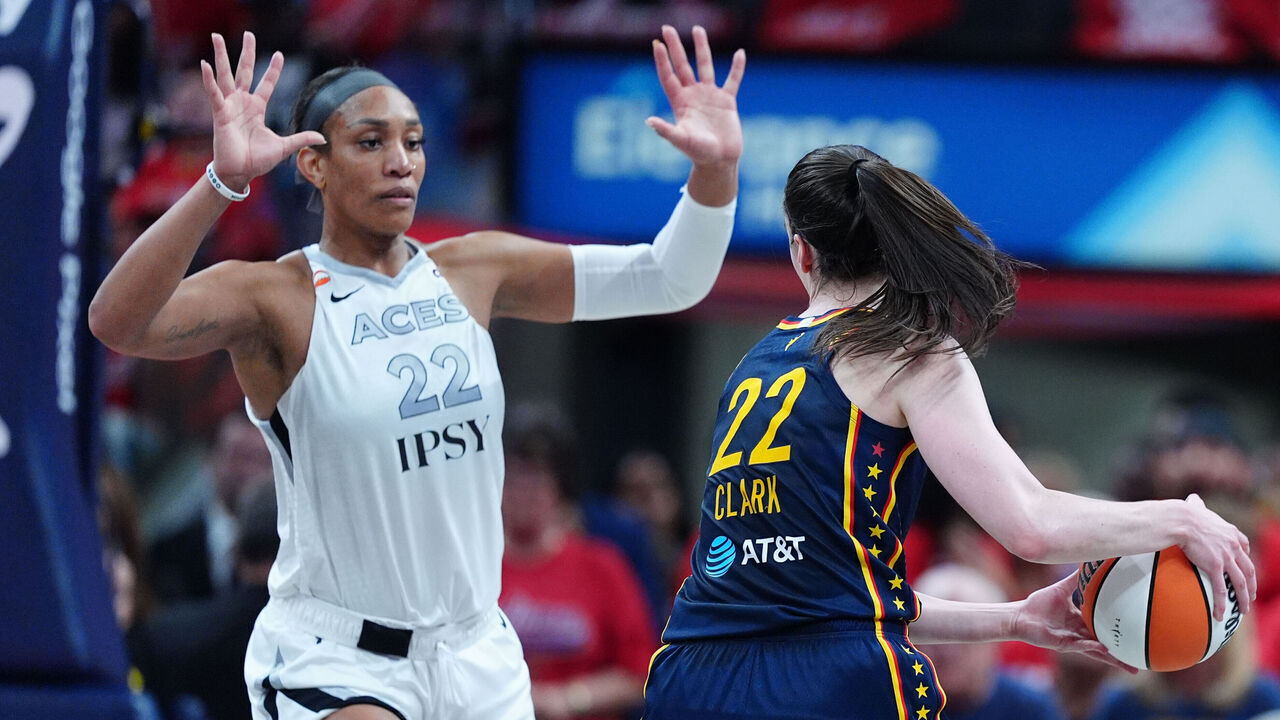 INDIANAPOLIS, IN - SEPTEMBER 29: Indiana Fever guard Caitlin Clark (22) is guarded by Las Vegas Aces forward A'ja Wilson (22) in game two of Round 1 of the WNBA Playoffs on September 29, 2026, at Gainbridge Fieldhouse in Indianapolis, Indiana.