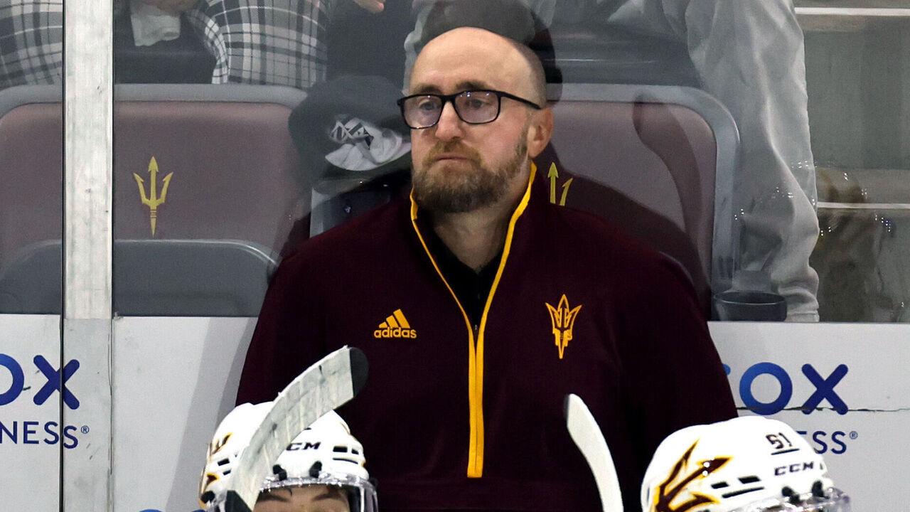 TEMPE, ARIZONA - OCTOBER 12: Head coach Greg Powers of Arizona State Sun Devils on the bench against the University of Michigan Wolverines during the second period at Mullett Arena on October 12, 2024 in Tempe, Arizona.