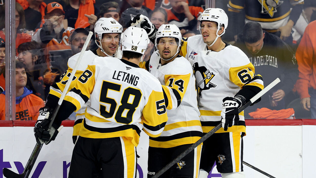 PHILADELPHIA, PENNSYLVANIA - SEPTEMBER 30: Nick Robertson #14 of the Pittsburgh Penguins celebrates his goal with Kris Letang #58, Sidney Crosby #87 and Rickard Rakell #67 during the first period against the Philadelphia Flyers at Xfinity Mobile Arena on September 30, 2026 in Philadelphia, Pennsylvania.