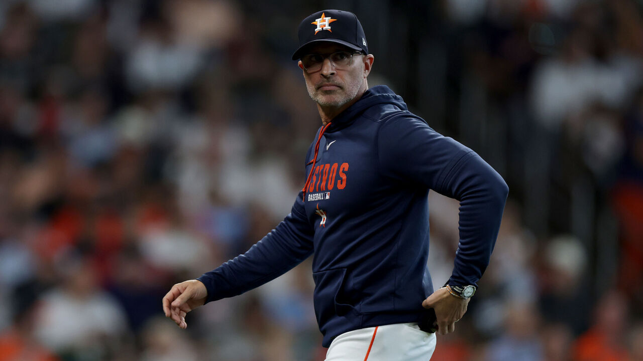 HOUSTON, TEXAS - SEPTEMBER 30: Manager Joe Espada #21 of the Houston Astros walks back to the dugout against the Chicago White Sox during the first inning in game two of the American League Wild Card Series at Daikin Park on September 30, 2026 in Houston, Texas.