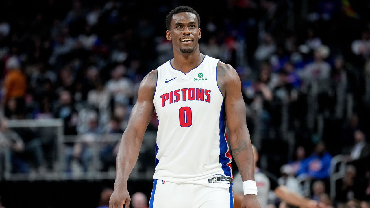 DETROIT, MICHIGAN - MARCH 31: Jalen Duren #0 of the Detroit Pistons looks on and smiles against the Toronto Raptors at Little Caesars Arena on March 31, 2026 in Detroit, Michigan.