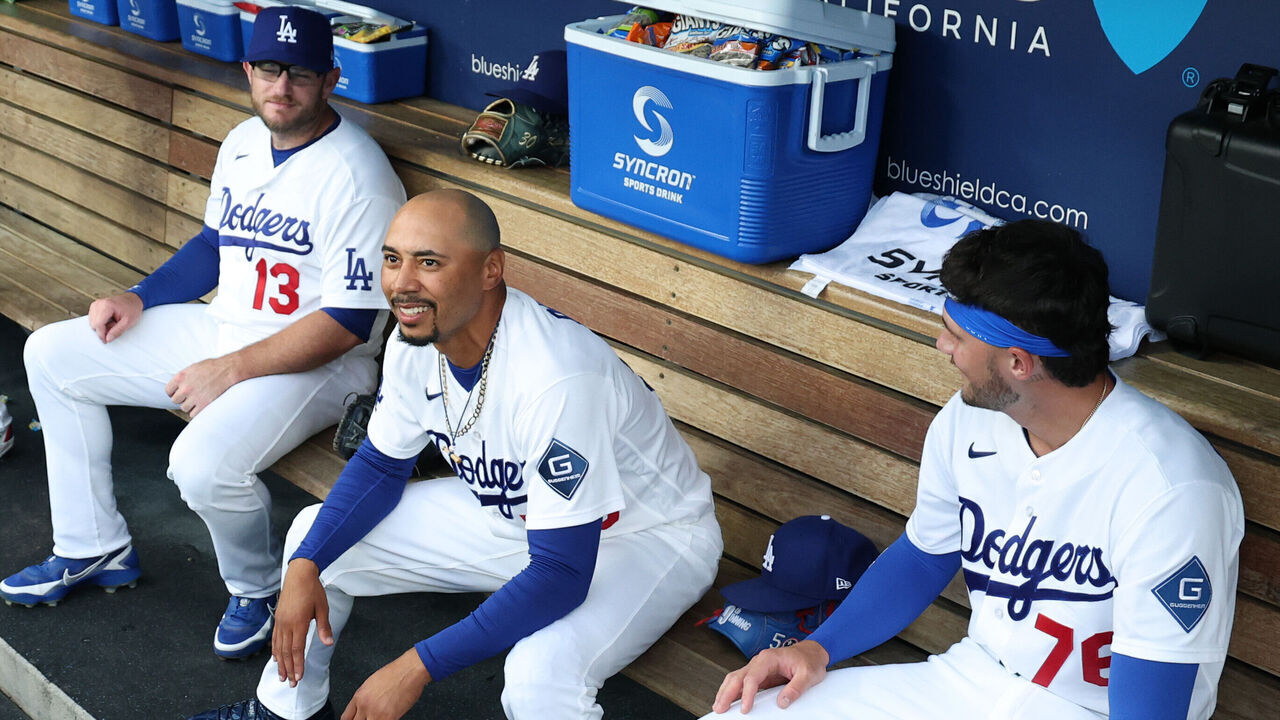 LOS ANGELES, CALIFORNIA - JULY 03: Mookie Betts #50 of the Los Angeles Dodgers jokes with Max Muncy #13 and Alex Freeland #76 before the game agains the San Diego Padres at Dodger Stadium on July 03, 2026 in Los Angeles, California.