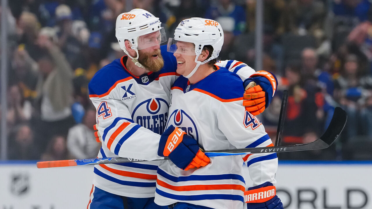 VANCOUVER, CANADA - OCTOBER 1: Kasperi Kapanen #42 of the Edmonton Oilers is congratulated after scoring a goal against the Vancouver Canucks during the second period of their NHL game at Rogers Arena on October 1, 2026 in Vancouver, British Columbia, Canada.