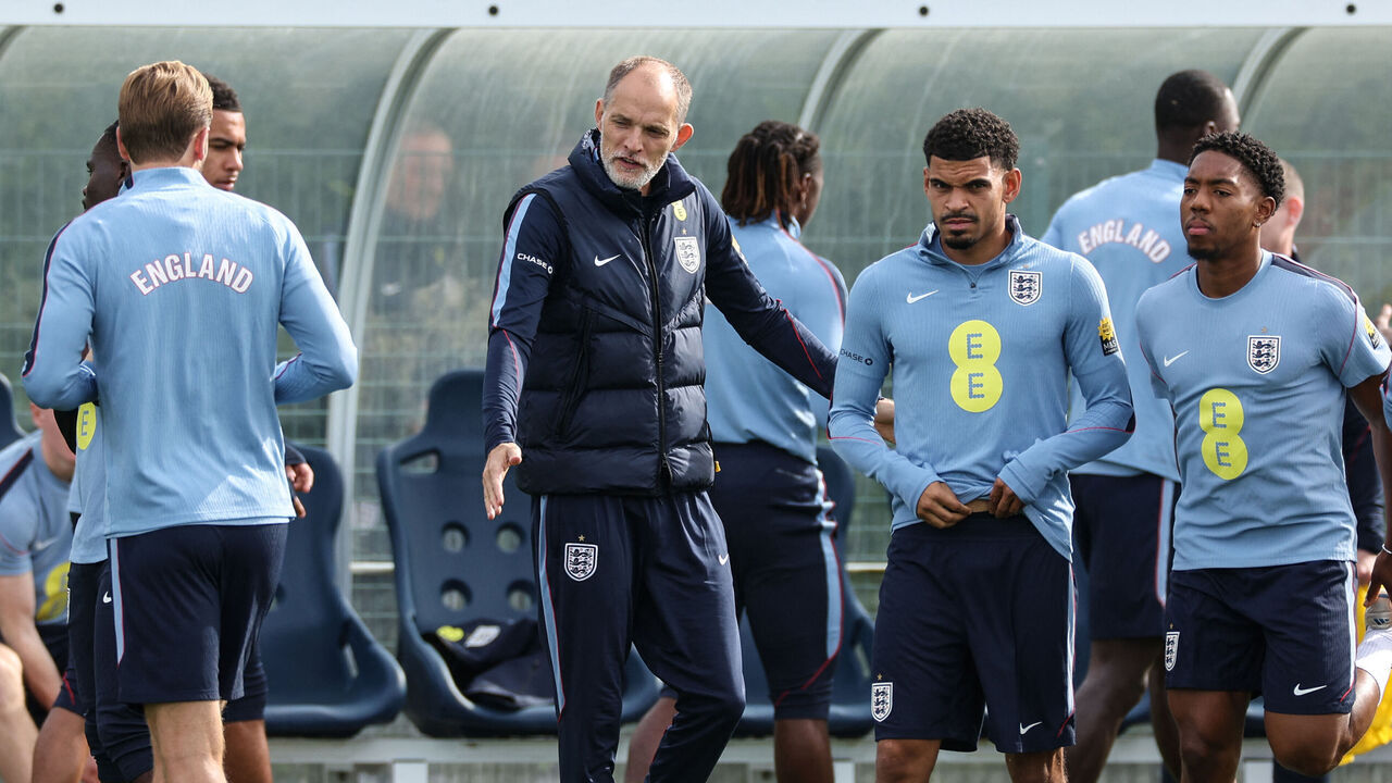 England's German head coach Thomas Tuchel (C) is joined by players at the start of a training session at Tottenham Hotspur's training ground in Enfield, north London on September 28, 2026, on the eve of their UEFA Nations League group stage football match against the Czech Republic.