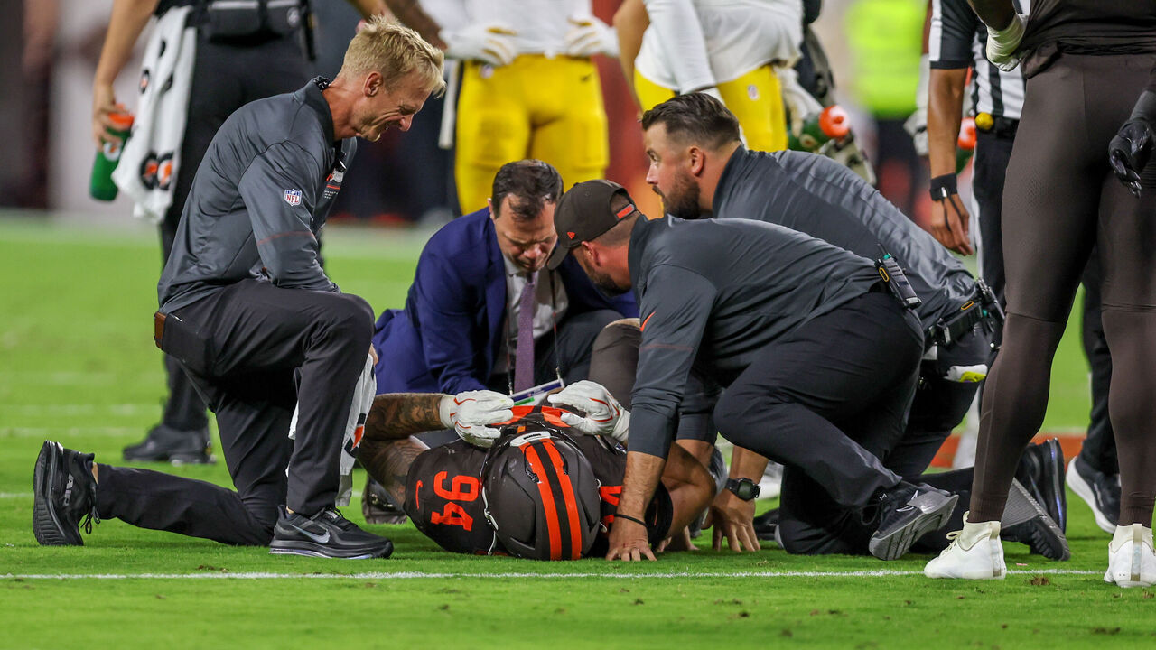 CLEVELAND, OH - OCTOBER 01: Cleveland Browns defensive tackle Mason Graham (94) is examined by the Cleveland Browns medical staff after injuring his knee during the first quarter of the National Football League game between the Pittsburgh Steelers and Cleveland Browns on October 1, 2026, at Huntington Bank Field in Cleveland, OH.