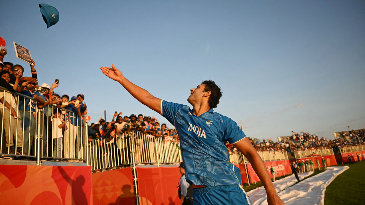 India's Shivam Dube throw his hat into the crowd as India celebrate their victory in the men's cricket final match between Pakistan and India during the 2026 Asian Games at the Korogi Athletic Park in Nisshin on October 3, 2026.