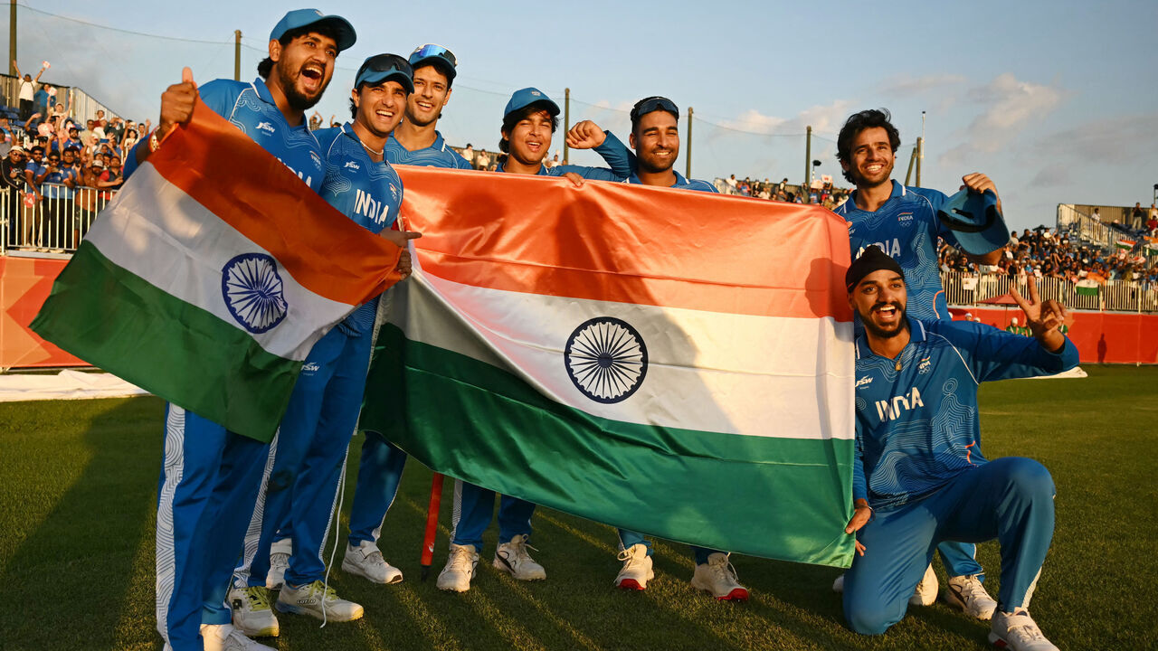 India's players celebrate their victory in the men's cricket final match between Pakistan and India during the 2026 Asian Games at the Korogi Athletic Park in Nisshin on October 3, 2026.