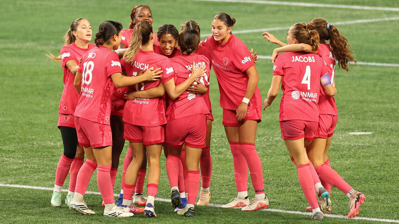 SEATTLE, WASHINGTON - OCTOBER 02: Gianna Paul #23 of North Carolina Courage celebrates with teammates after scoring the first goal of the team during the NWSL match between Seattle Reign and North Carolina Courage at Lumen Field on October 02, 2026 in Seattle, Washington.