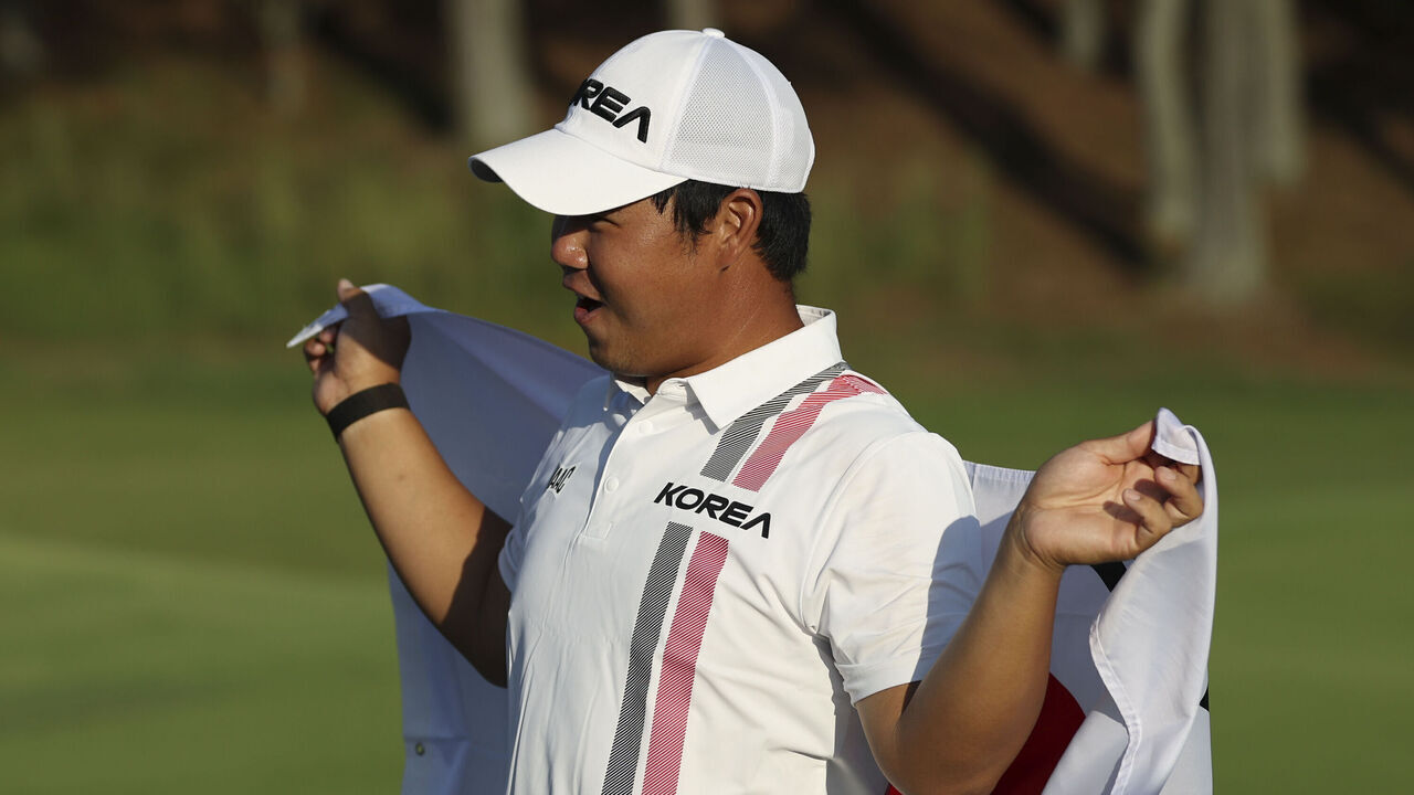 KASUGAI, JAPAN - OCTOBER 03: Joohyung Kim(Tom Kim) of South Korea celebrates after winning gold during the Golf Men's final round of the 20th Asian Games Aichi-Nagoya at Kasugai Country Club East Course on October 03, 2026 in Kasugai, Aichi, Japan.