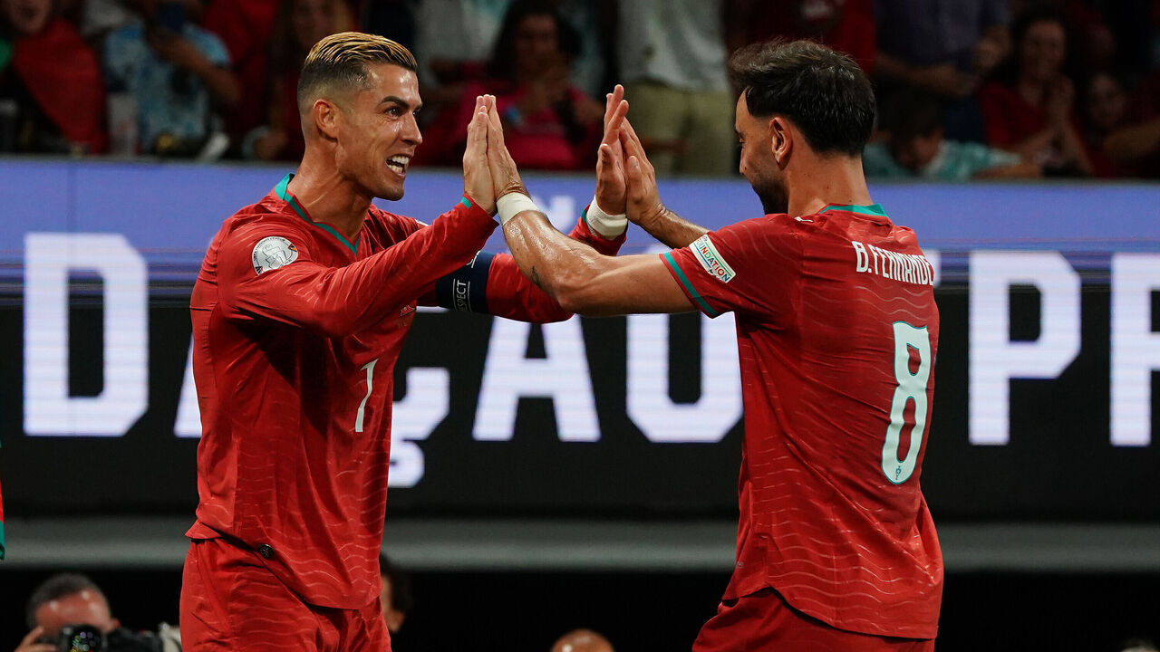 LISBON, PORTUGAL - SEPTEMBER 24: Cristiano Ronaldo of Portugal celebrates with teammate Bruno Fernandes of Portugal after scoring a goal which was later disallowed during the UEFA Nations League 2026/27 Group A4 MD1 match between Portugal and Wales at Estadio Jose Alvalade on September 24, 2026 in Lisbon, Portugal.