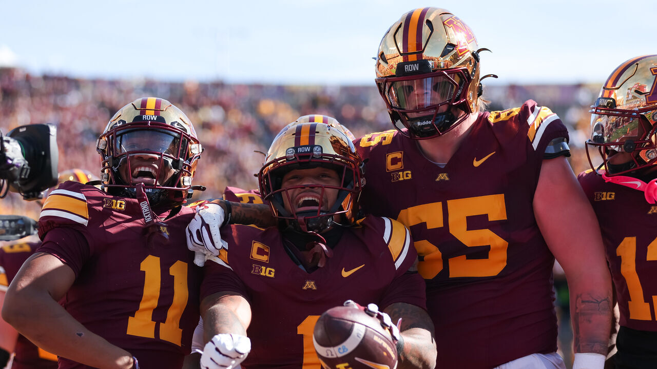 MINNEAPOLIS, MN - OCTOBER 03: Minnesota Golden Gophers running back Darius Taylor (1) celebrates with wide receiver Javon Tracy (11) and offensive lineman Greg Johnson (65) after scoring a touchdown during the first half to the college football game between the Michigan Wolverines and the Minnesota Golden Gophers on October 3rd, 2026, at Huntington Bank Stadium in Minneapolis, MN.