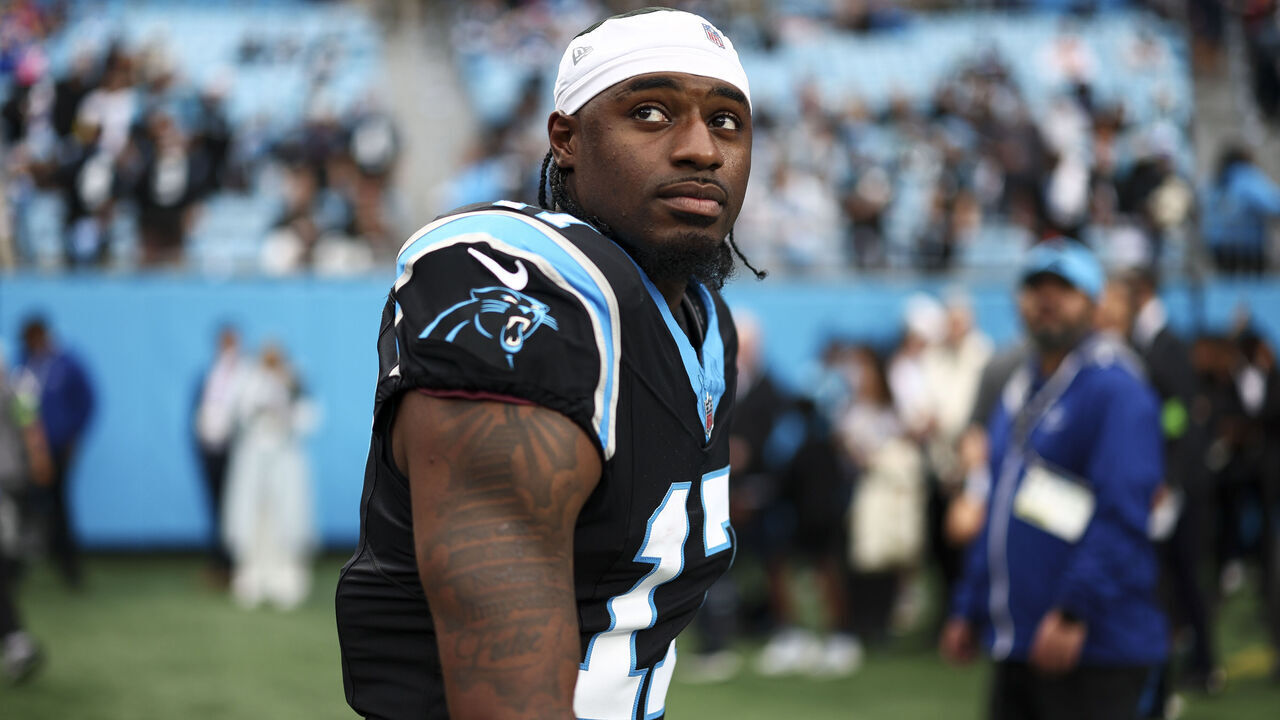 CHARLOTTE, NORTH CAROLINA - JANUARY 10: Xavier Legette #17 of the Carolina Panthers warms up prior to an NFL wild card playoff football game against the Los Angeles Rams at Bank of America Stadium on January 10, 2026 in Charlotte, North Carolina.