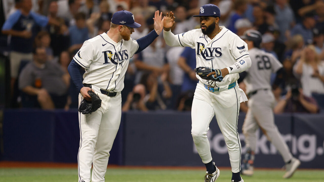 ST PETERSBURG, FLORIDA - OCTOBER 03: Drew Rasmussen #57 and Junior Caminero #13 of the Tampa Bay Rays celebrate during the eighth inning against the New York Yankees in game one of the American League Division Series at Tropicana Field on October 03, 2026 in St Petersburg, Florida.