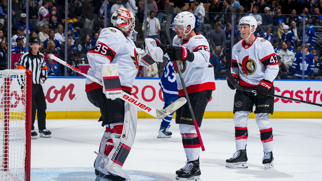 TORONTO, ON - OCTOBER 3: Linus Ullmark #35 of the Ottawa Senators celebrates with teammates Thomas Chabot #72 and Tyler Kleven #43 during the third period at the Scotiabank Arena on October 3, 2026 in Toronto, Ontario, Canada.