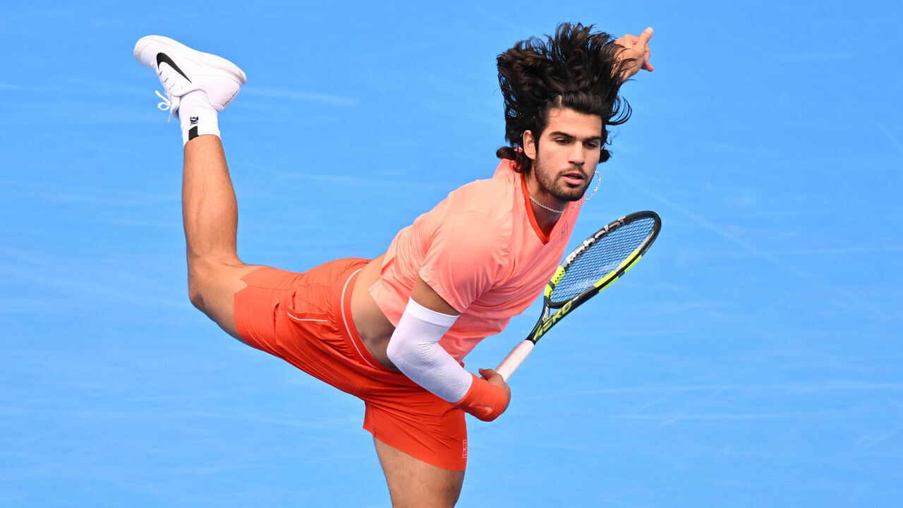 TOKYO, JAPAN - OCTOBER 04: Carlos Alcaraz of Spain serves against Denis Shapovalov of Canada during their Men's singles quarterfinal match on day four of Kinoshita Group Japan Open at Ariake Tennis Park on October 04, 2026 in Tokyo, Japan.