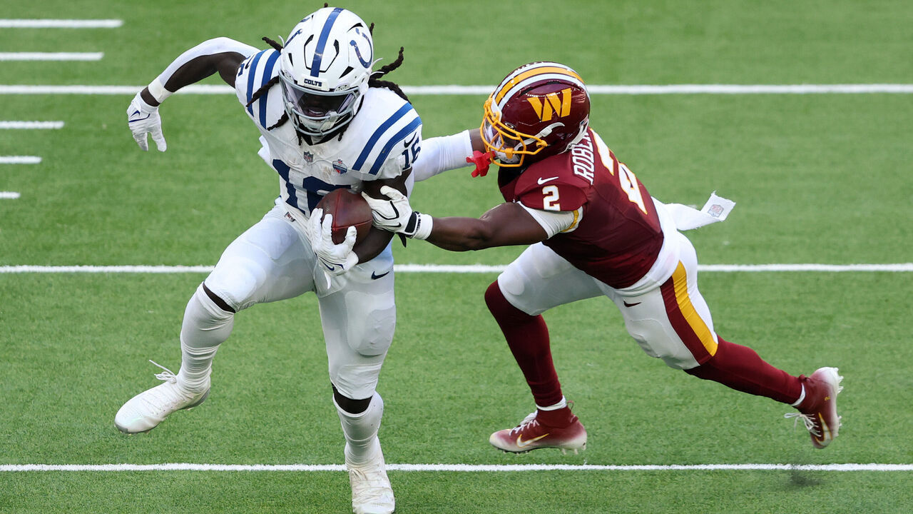 LONDON, ENGLAND - OCTOBER 04: Ashton Dulin of the Indianapolis Colts is tackled by Amik Robertson of the Washington Commanders during the NFL match between Indianapolis Colts and Washington Commanders as part of the London NFL Series 2026 at Tottenham Hotspur Stadium on October 04, 2026 in London, England.
