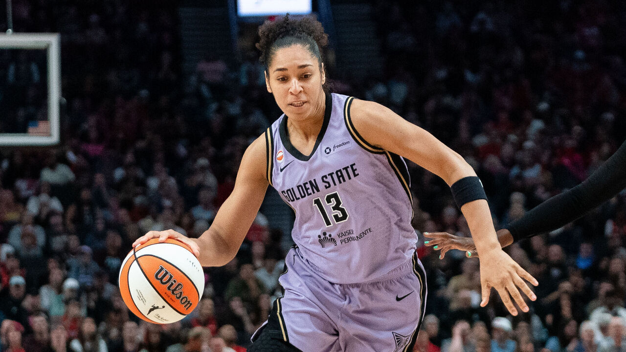 PORTLAND, OREGON - SEPTEMBER 22: Janelle Salaun #13 of the Golden State Valkyries drives around Serah Williams #25 of the Portland Fire during the second half at Moda Center on September 22, 2026 in Portland, Oregon.