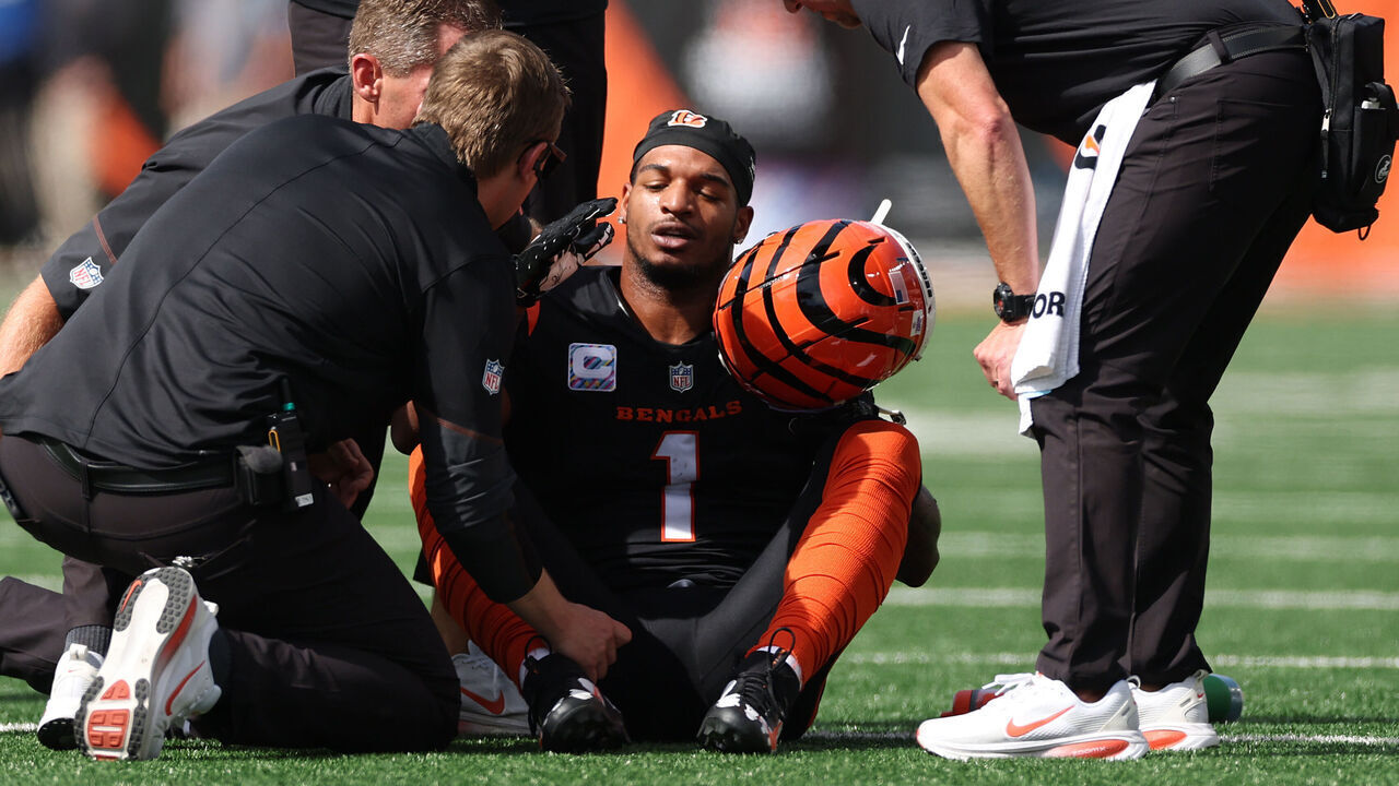 CINCINNATI, OHIO - OCTOBER 04: Ja'marr Chase #1 of the Cincinnati Bengals is evaluated by medical staff during the second quarter of the game against the Jacksonville Jaguars at Paycor Stadium on October 04, 2026 in Cincinnati, Ohio.