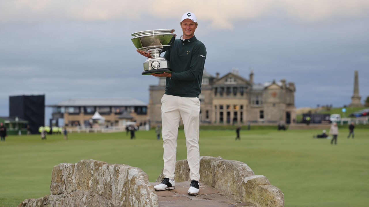 Adrian Meronk of Poland with his trophy on Swilcan Bridge after winning the Alfred Dunhill Links Championship 2026 at the Old Course at St Andrews. Picture date: Sunday October 4, 2026.
