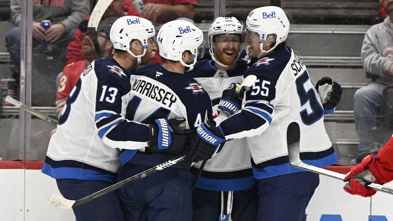 DETROIT, MI - OCTOBER 04: Winnipeg Jets left wing Kyle Connor (81) celebrates his first period goal with teammates during game between Winnipeg Jets and Detroit Red Wings on October 4, 2026 at Little Caesars Arena in Detroit, MI